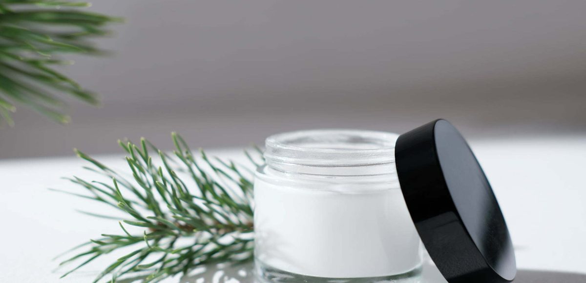 Open cream container with cream inside